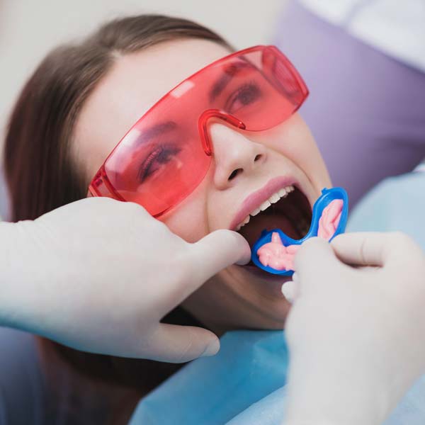 A woman undergoing fluoride treatment