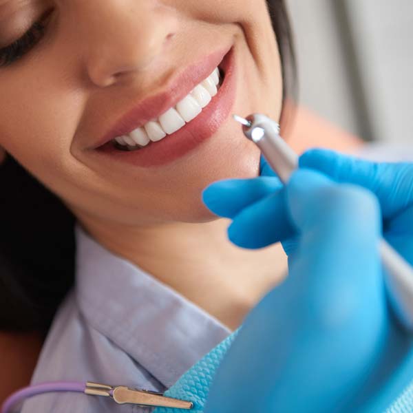 A woman having her teeth cleaned