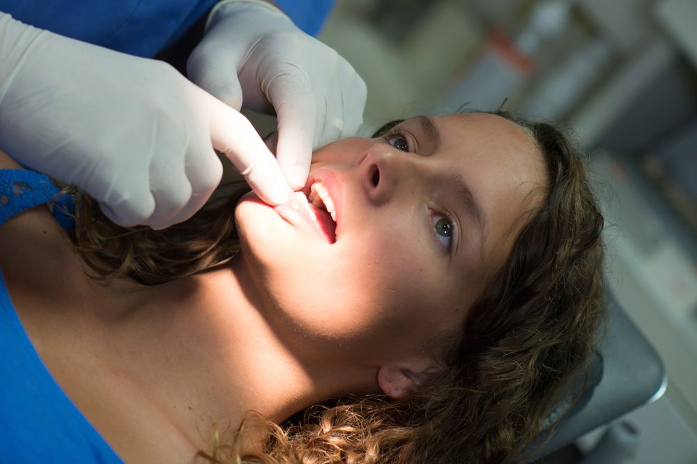 Image of woman receiving dental exam
